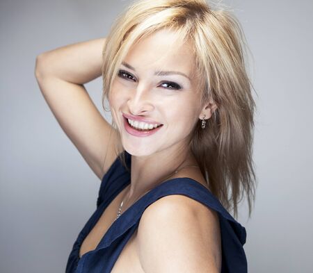 Portrait Of Young Smiling Beautiful blonde Womanの写真素材