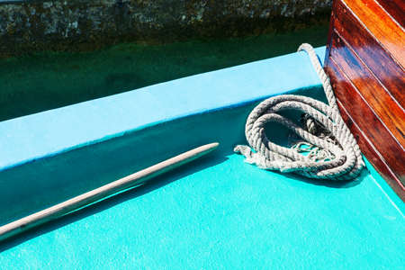 White mooring rope on boat or ship, shallow dof, tinted blue, copy spaceの写真素材