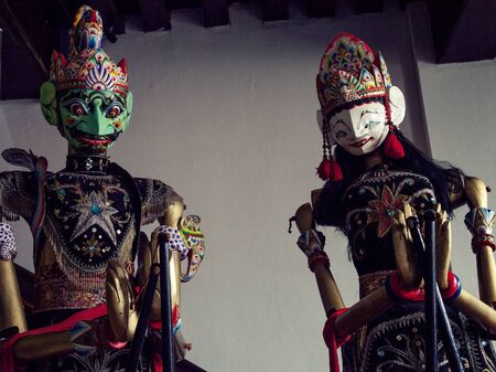 traditional Javanese Wayang Golek theatre puppets being sold as sourvenirs in Javaの写真素材