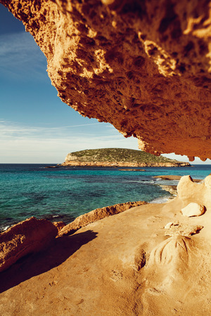 Beautiful sandy Cala Comte beach with azure blue sea water, Ibiza island, Spain.の写真素材