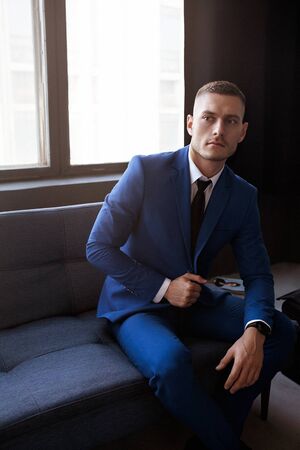 Stylish young man in a suit and tie. Business style. Fashionable image. Evening dress.の写真素材