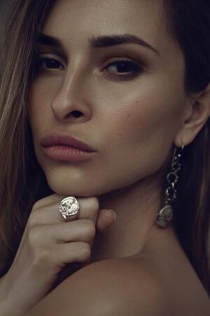 Beauty portrait of woman model with steampunk design jewelryの写真素材