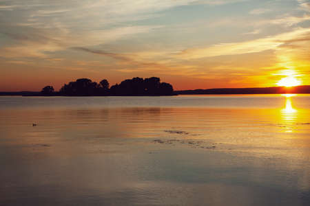 Sunset water horizon landscape. Sunset water scene. River sunset horizon view. Sunset water landscapeの写真素材