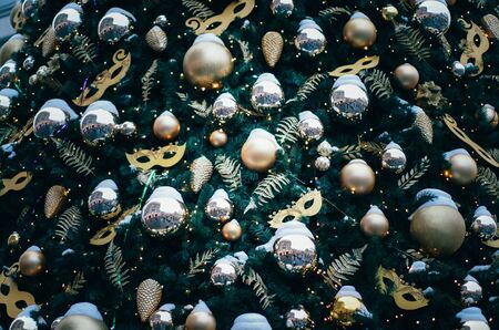 Gold and pink leaves, mask and leaves close up. Christmas and new year backgroundの写真素材
