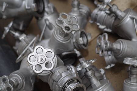 Industrial valves with red wheels. close-up of pipe valve connectionの写真素材