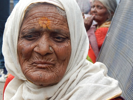Hyderabad,India-July21,2014-Portriat of Indian senior woman begging on a busy roadのeditorial素材