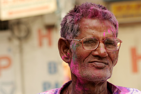 Hyderabad,India-March 6,2015:Hindu old man celebrating Holi, or festival of colors,annual Popular festival festival for Hindus and non-Hindus in most parts of the world.のeditorial素材