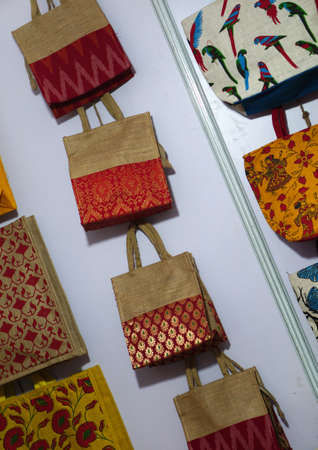 indian woman handicrafts  hand bags in shop display