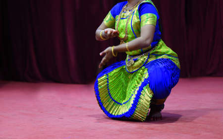 Indian woman perform traditional bharatanatyam dance
