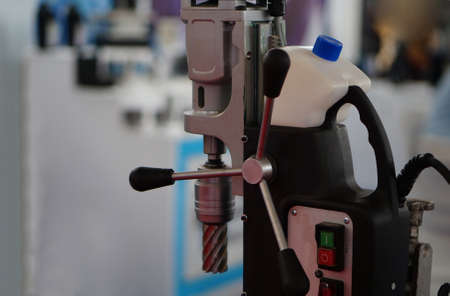 Close -up view of wheel handle of work shop drilling machinery
