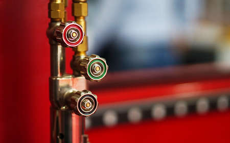 Close-up view of rotating knob for controlling operations of process in pipelines in a Industry