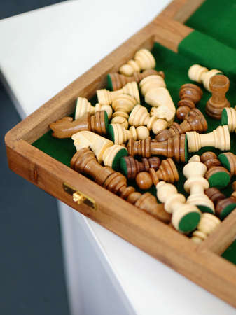 Close-up view of chess board and pieces in the box