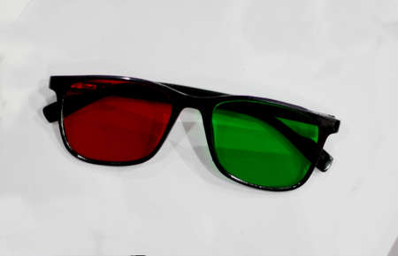 Close-up view of red and green glass spectacles in eye sight testing clinicの写真素材