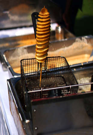 view of making Indian street food twisted or spiral or tornado photo chips
