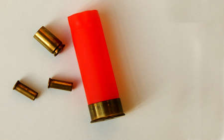 Close-up view of used bullets or ammunition isolated on white backgroundの写真素材