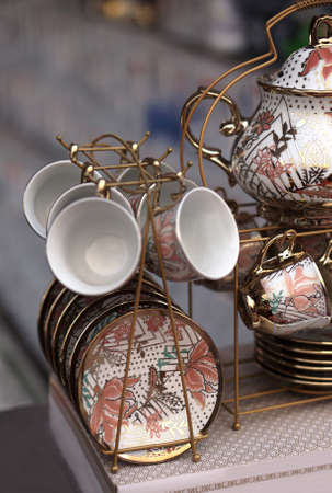 Close-up view of  porcelain tea cups and other kitchen ware in shop display