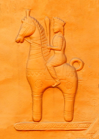 View of wall art of man riding horse in a public park
