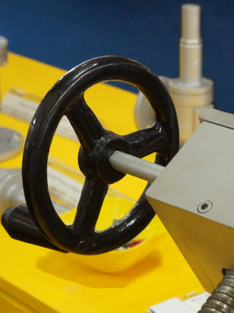 View of circular wheel handle control mechanism of a motor in an industry