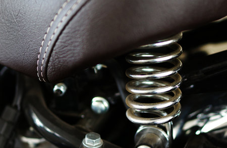 Close-up view of seat of a motor bike with springs for cushion effectの写真素材