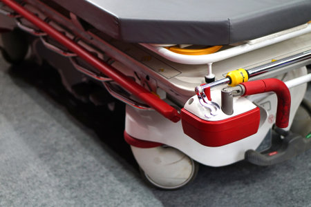 Close-up view of a Metallic hospital bed  with controls for patients comfortの写真素材