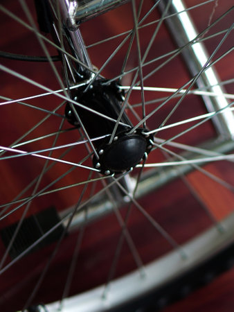 Close-up view of wheel and sprocket of patient wheel chairの写真素材