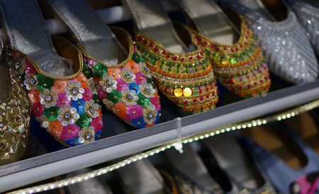 Close-up view of Indian woman fashion hand made crafted foot wear in shop displayの写真素材