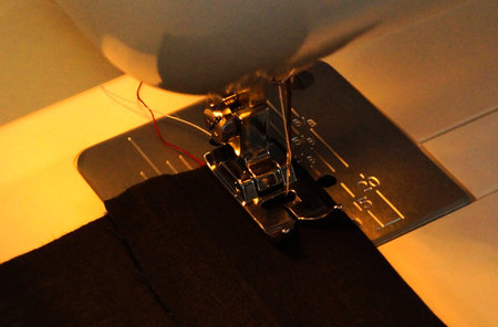 Close-up view of sewing machine needle and other partsの写真素材