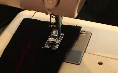 Close-up view of sewing machine needle and other partsの写真素材