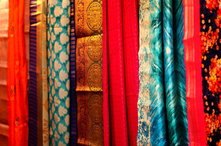 Close-up view of Indian woman wear saris or sarees hung in shop displayの写真素材