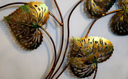 Close-up View of metal floral art with leavesの写真素材