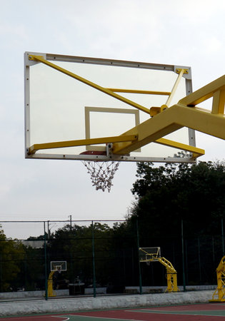 Close-up view of Basket ball goal board with  hoop and ring against blue sky