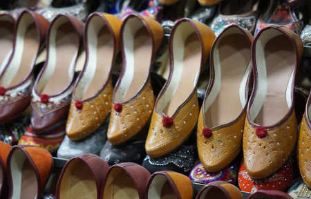 Close-up of indian woman fashion foot wear n shop displayの写真素材