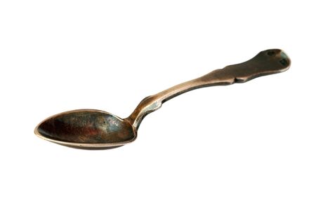 Isolated antique spoon over white backgroundの写真素材