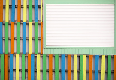 Colorful wall background with window and a wooden boards