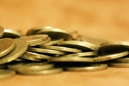 Gold money coins - savings, wealth, money conceptの写真素材