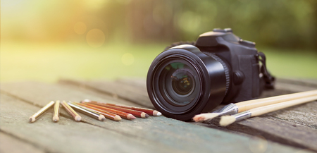 Camera with pencil and brush - website bannerの写真素材
