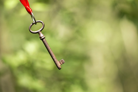 Success idea - a key hanging in the airの写真素材