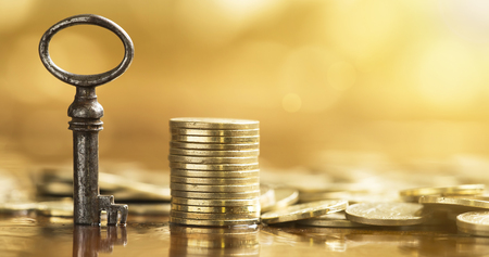 Business success banner - key and golden money coinsの写真素材