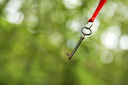 Hanging key - solution concept backgroundの写真素材