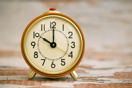 Time concept - orange alarm clock closeupの写真素材
