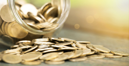 Website banner of golden coins closeup - money savings conceptの写真素材