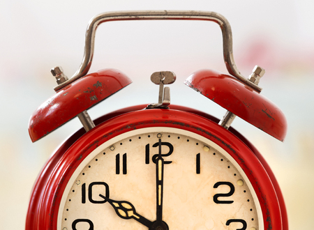 Time concept - old red retro alarm clock close-upの写真素材