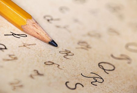 Dyslexia concept, pencil and alphabet letters handwriting, homework