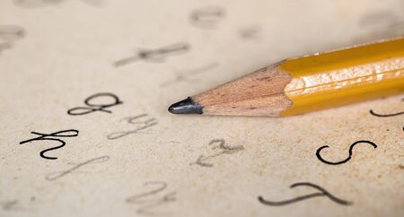 Back to school concept, pencil tip with handwritter abc letters, close-upの写真素材