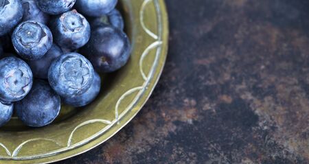 Healthy eating, diet, blueberries antioxidant fruits, snack foods on metal grunge background, web banner with copy spaceの写真素材