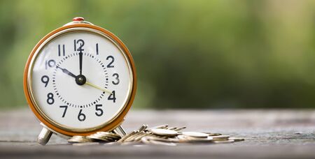 Web banner of save time concept, alarm clock with money coinsの写真素材