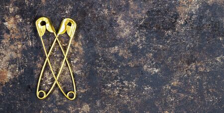 Business success and relationship concept, two safety pins, web banner with copy spaceの写真素材