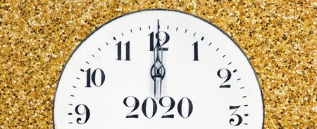 New year 2020 countdown, midnight clock face on a shiny yellow gold glitter textured background, web...