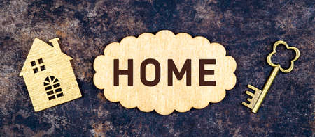 House shape and gold key, home loan, mortgage, dream home concept. Web banner.の写真素材