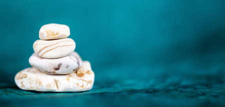 Balance stones on blue background, coaching, life coach bannerの写真素材
